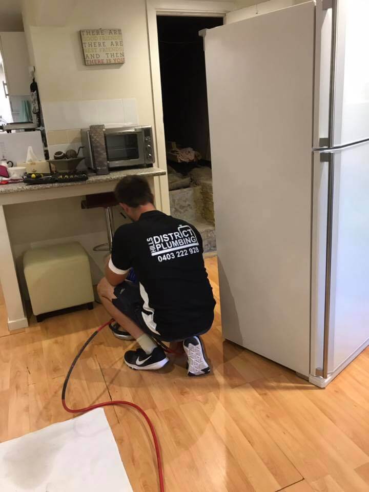 Plumber using a drain camera at a customer's house