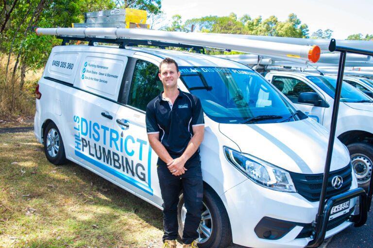 Plumbing Professional Waiting Outside Vehicle in Castle Hill