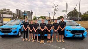 Hills District Plumbing plumbers standing in front of their vehicles.