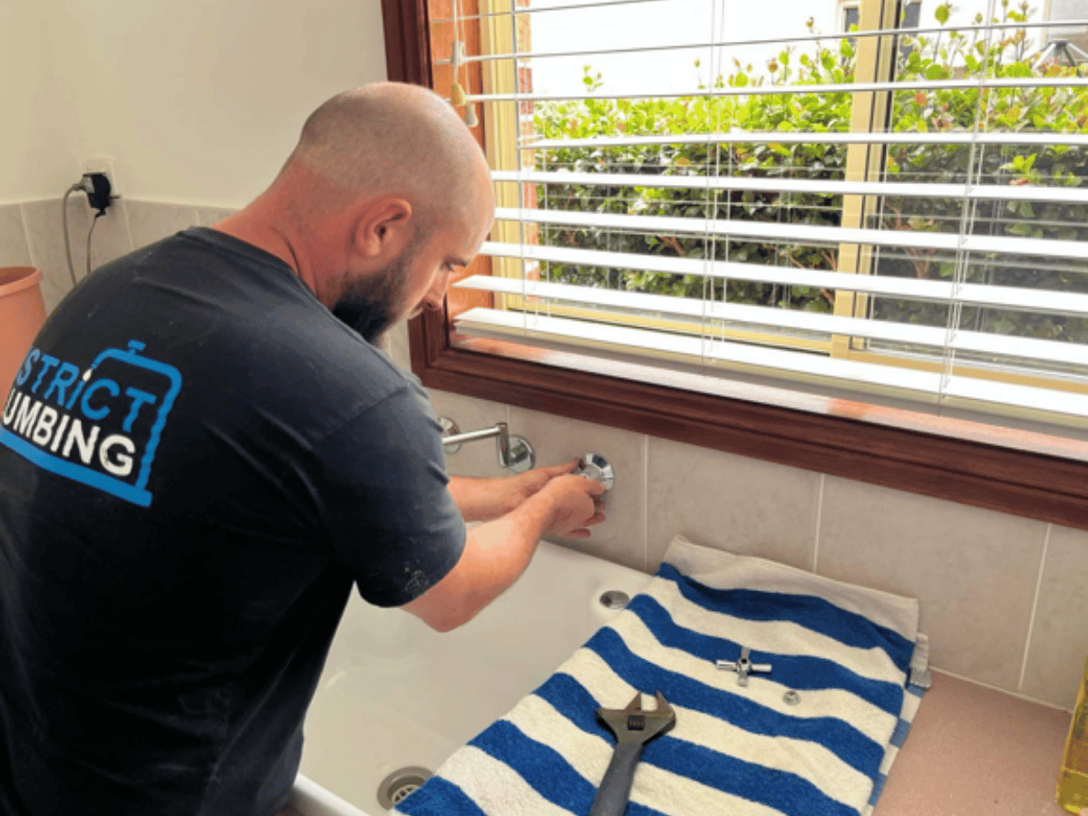 Plumber fixing tap