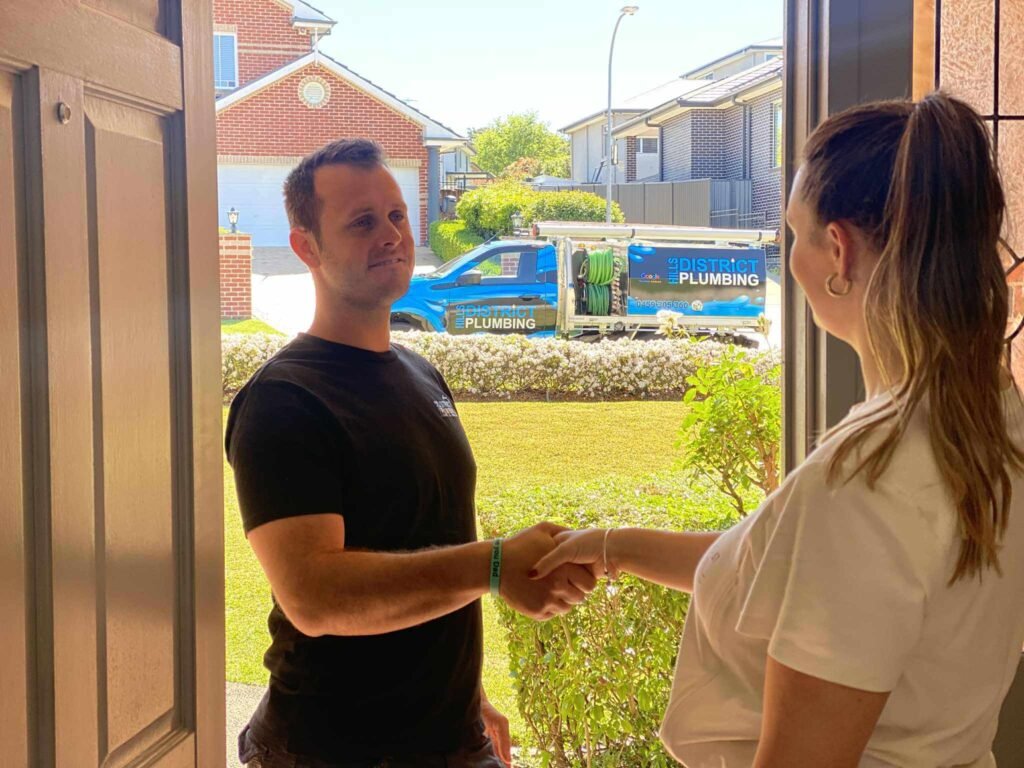 Customer greeting our plumber at the front door